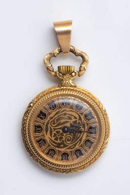 an image of a close up of a clock on a white surface
