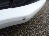 a close up of a car ' s bumper with a lot of rust on it
