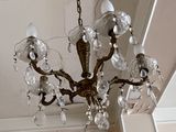 a chandelier hanging from the ceiling in a room