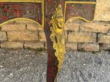 an image of a table with a red and gold decoration on it