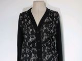 black and white cardigan sweater on a mannequin mannequin mannequin mannequin mannequin mannequin mannequin mannequin