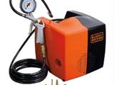 an orange and black portable air compressor with gauge and hose
