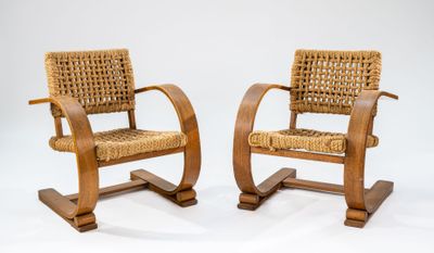 two wooden chairs with wicker seats on a white background