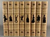 a set of six books with silhouettes of people on them