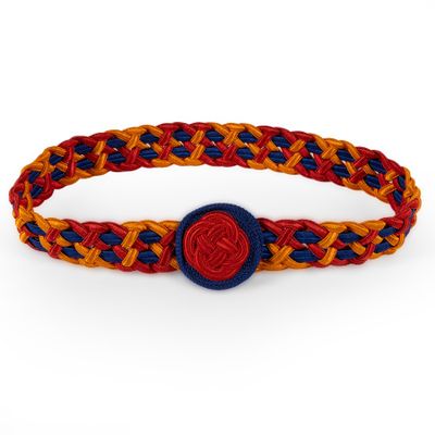 a close up of a braided bracelet with a red and blue button