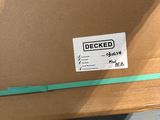 a cardboard box with a sticker on it sitting on the ground