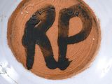 a plate with a picture of a man and a woman on it