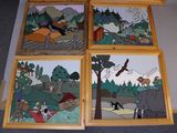 four pictures of a wooden frame with a picture of a forest scene