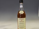 a bottle of whisky sitting on a counter