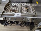 a stove that has a lot of burners on it