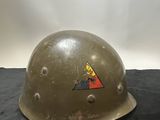 an old army helmet with a triangle on it sitting on a black surface