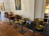 many bowls and pans on a table in a room
