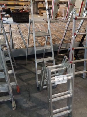 many ladders that are sitting in a room