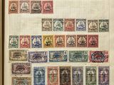 an open book with a bunch of stamps on it