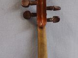 a violin that is sitting on the wall