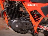 a close up of a red motorcycle with a black seat