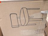 a cardboard box with a drawing of a toilet on it