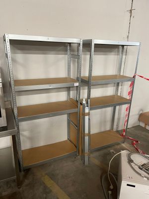 two shelves that are in the middle of a room
