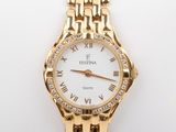 an image of a close up of a wrist watch on a white surface