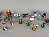 many figurines of different types and sizes on the table