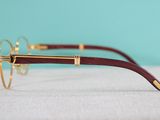 a close up of a pair of glasses sitting on top of a table
