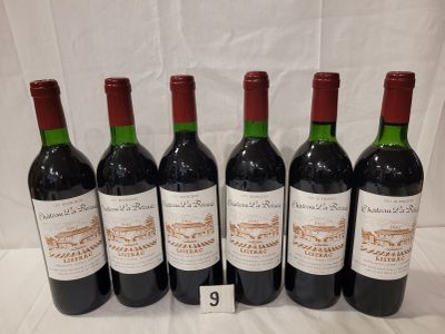 six bottles of wine are lined up on a table