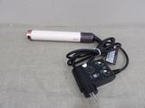 a cord that is plugged into a small device