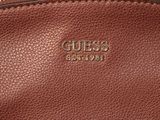 the inside of a brown leather purse with the word guess on it