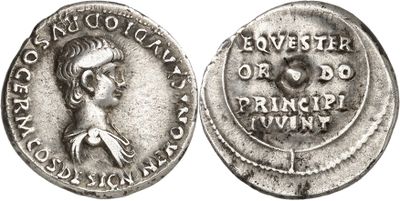 a silver coin with an image of a woman on it
