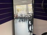 a bike that is sitting in front of a mirror in a room