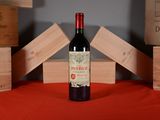 a bottle of wine that is sitting on a table