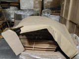 a large pile of cardboard in the middle of a warehouse