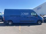 the blue van is parked in the parking lot next to other cars