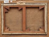 an old wooden easel with two wooden frames on top of it