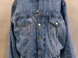 denim jacket with white polka dots on the sleeves and cuffs