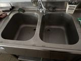 two sinks in the kitchen that have been cleaned