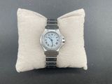 an image of a watch sitting on top of a pillow on a table