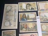 a lot of different bank notes on the table