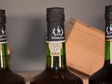 three bottles of wine that are sitting on a table