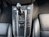 a close up of a car ' s interior with a gear lever
