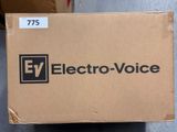 an electric voice box sitting on the floor in front of a box