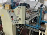 an image of a machine that is working on a piece of paper