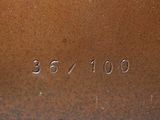a close up of a brown vase with numbers on it