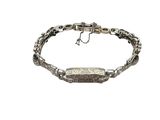 a silver bracelet with a stone bar on a chain