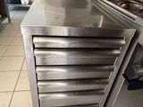 a kitchen with stainless steel appliances in it