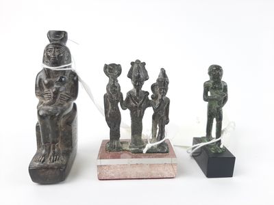 three statues of a man and a woman and a man and a woman