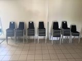 several chairs are lined up against a wall in a waiting room
