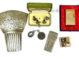 a lot of silver items that are sitting on a table