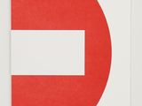 a red and white no entry sign on a white wall