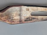 a silver spoon that has a handle on it